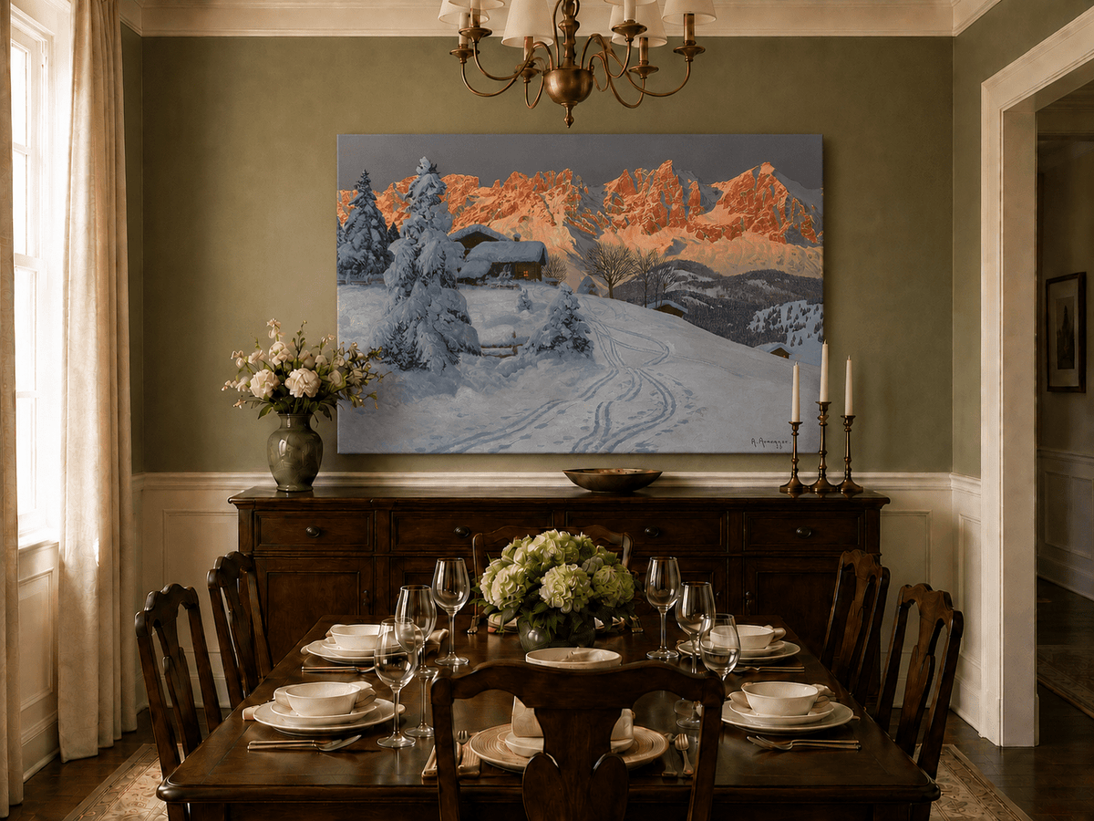 Unframed hand-painted winter alpine oil painting with a snowy cabin and mountains at sunset displayed above a formal dining table.