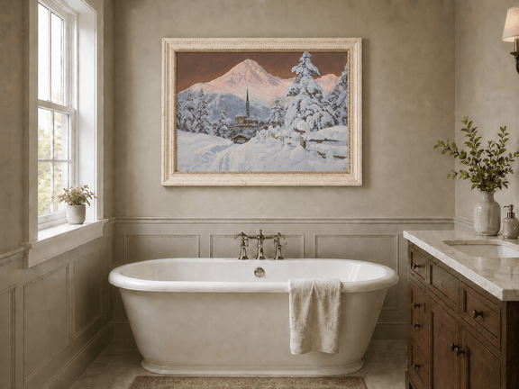 Framed hand-painted snowy alpine village oil painting with a church and pink mountain peaks displayed above a freestanding bathtub.