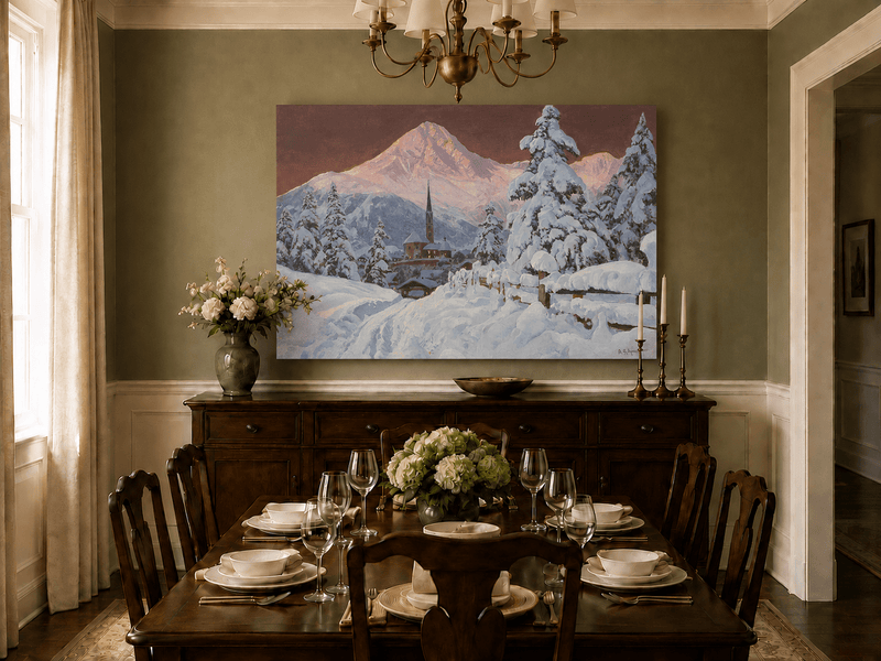 Unframed hand-painted snowy alpine village oil painting with a church and pink mountain peaks displayed above a formal dining table.