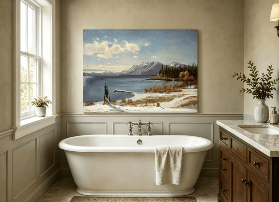 Unframed hand-painted snowy lake oil painting with a winter path and distant mountain view displayed above a freestanding bathtub.