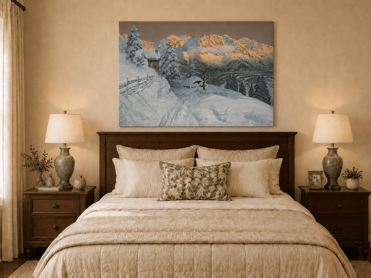 Unframed hand-painted winter mountain oil painting with a snowy hut and tracks displayed above a wooden bed in a neutral bedroom.