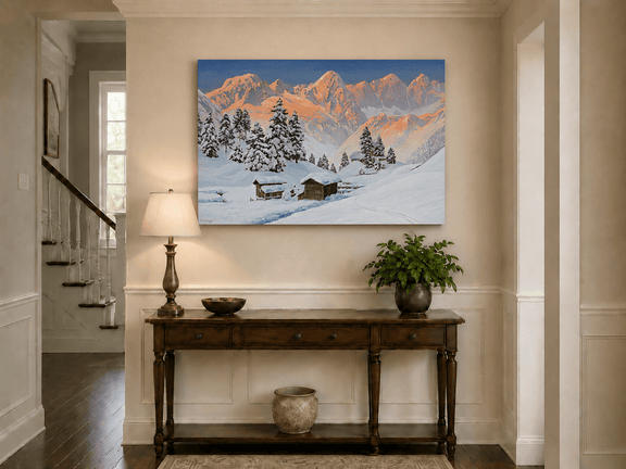Unframed hand-painted snowy mountain oil painting with alpine huts glowing at sunset displayed above an entryway console table.