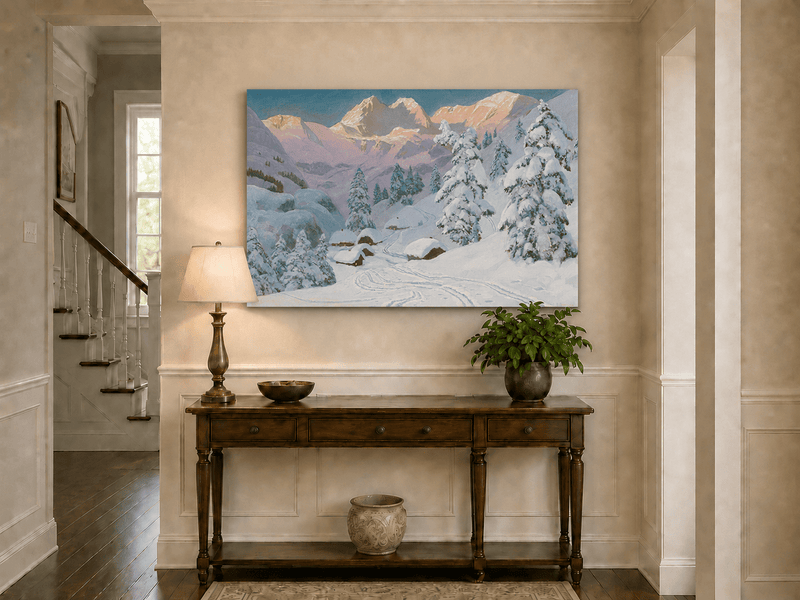 Unframed hand-painted winter mountain oil painting with snowy huts and tracks displayed above an entryway console table.
