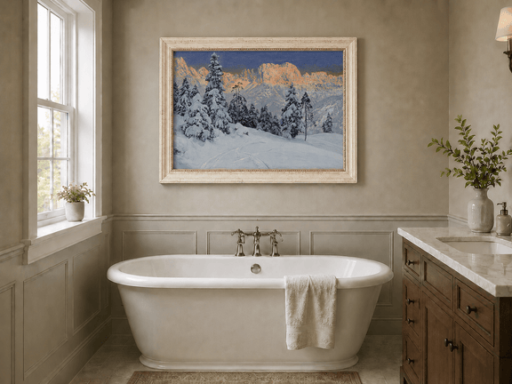 Framed hand-painted winter mountain oil painting with snow-covered pine trees and footprints displayed above a freestanding bathtub.