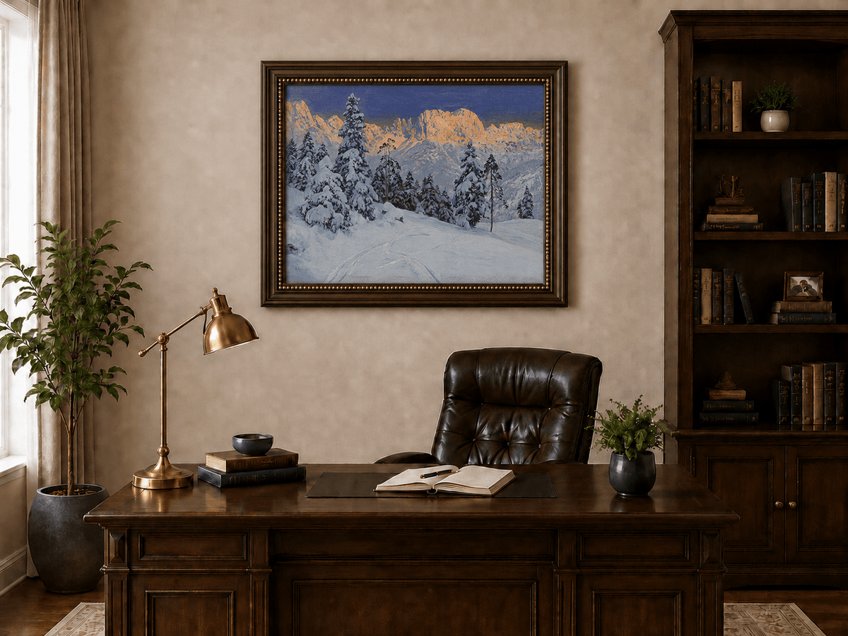 Framed hand-painted winter mountain oil painting with snow-covered pine trees and footprints displayed above a traditional home office desk.