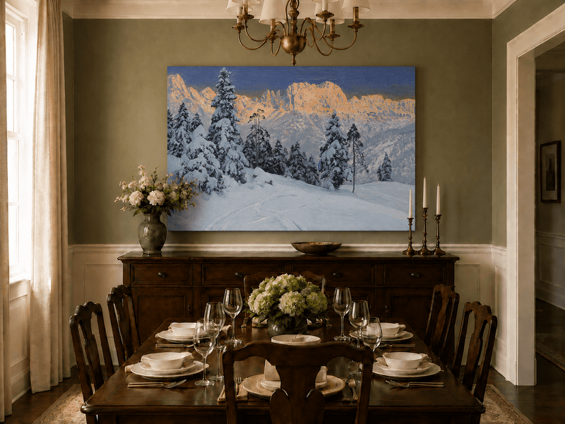 Unframed hand-painted winter mountain oil painting with snow-covered pine trees and footprints displayed above a formal dining table.