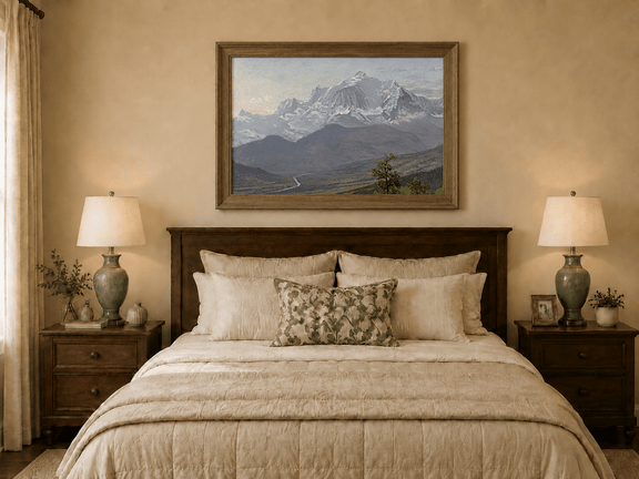 Framed hand-painted snowy mountain valley oil painting with a winding river and rolling hills displayed above a wooden bed in a neutral bedroom.