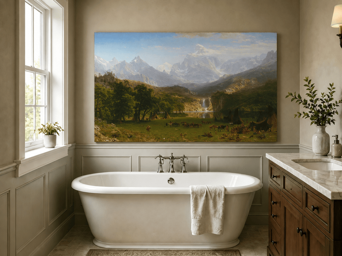 Unframed hand-painted mountain landscape oil painting with snowy peaks, a lake and teepee camp displayed above a freestanding bathtub.