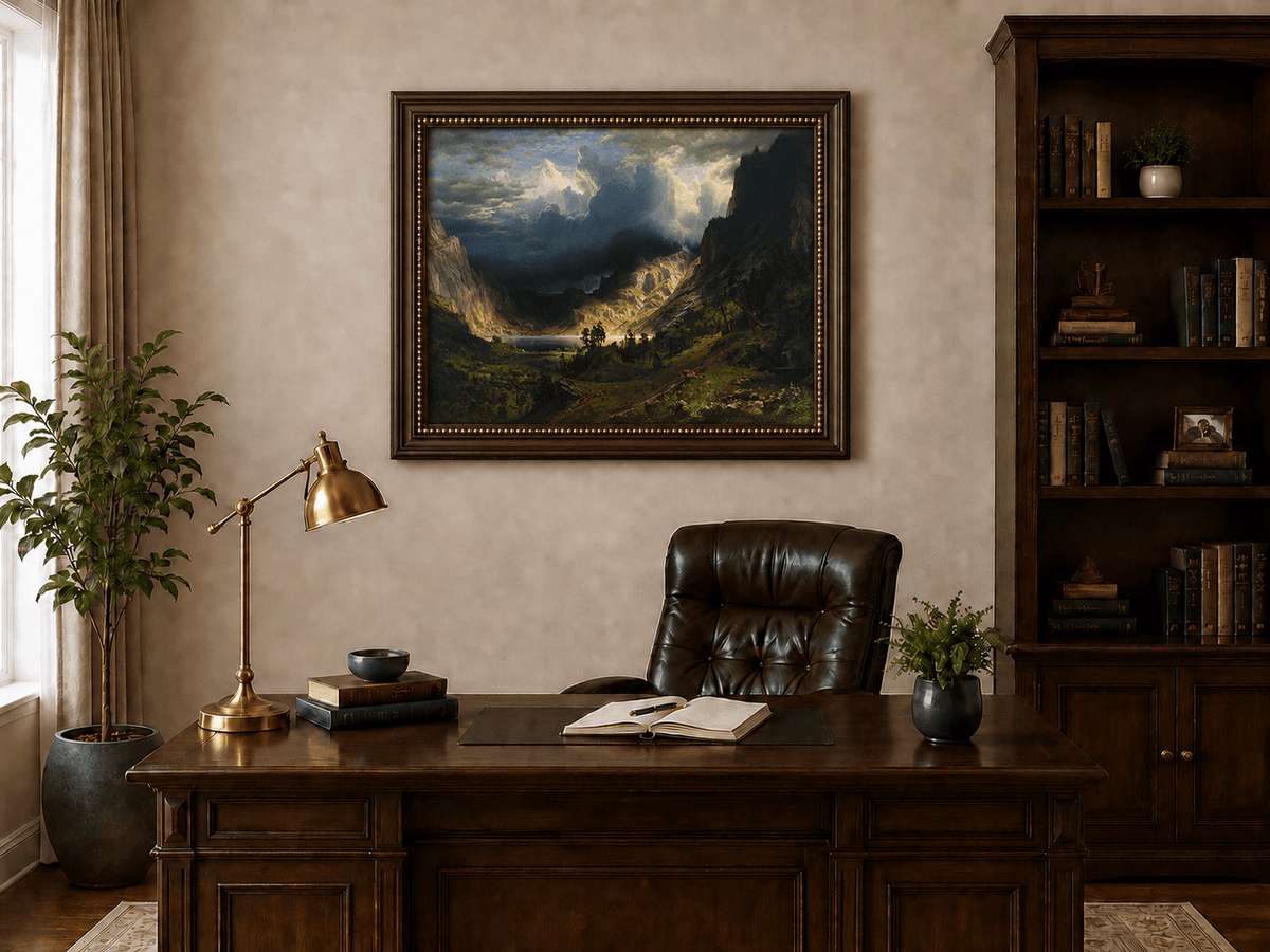 Framed hand-painted Rocky Mountains oil painting with a dramatic storm over Mount Rosalie displayed above a traditional home office desk.