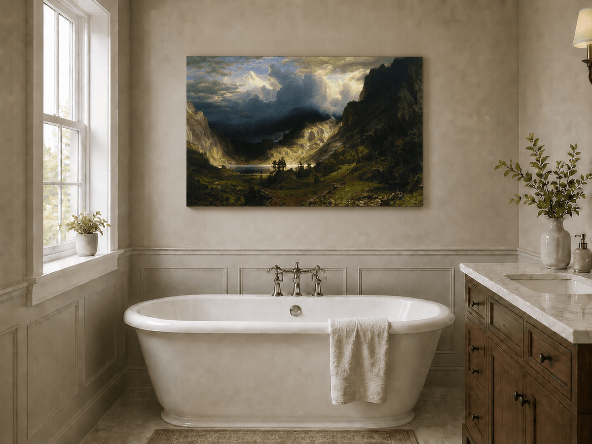 Unframed hand-painted Rocky Mountains oil painting with a dramatic storm over Mount Rosalie displayed above a freestanding bathtub.