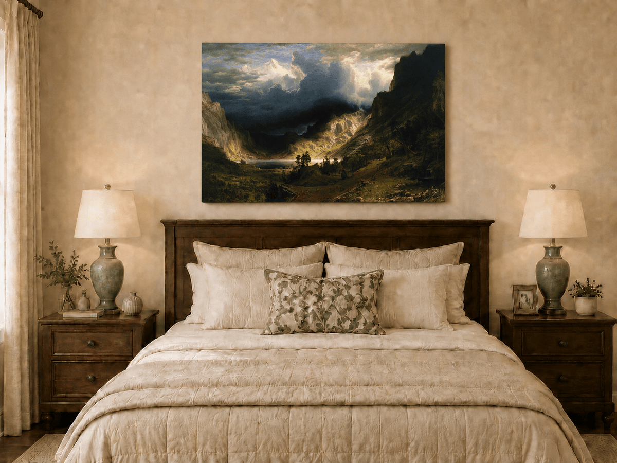 Unframed hand-painted Rocky Mountains oil painting with a dramatic storm over Mount Rosalie displayed above a wooden bed in a neutral bedroom.