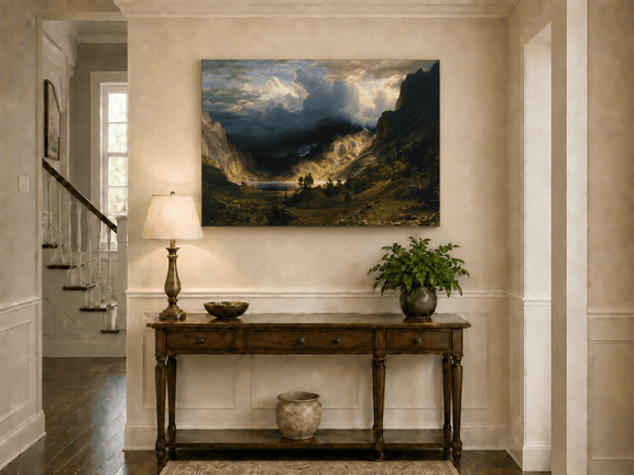 Unframed hand-painted Rocky Mountains oil painting with a dramatic storm over Mount Rosalie displayed above an entryway console table.