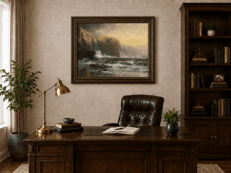 Framed hand-painted stormy seascape oil painting with a reef, surf and golden coastal cliffs displayed above a traditional home office desk.