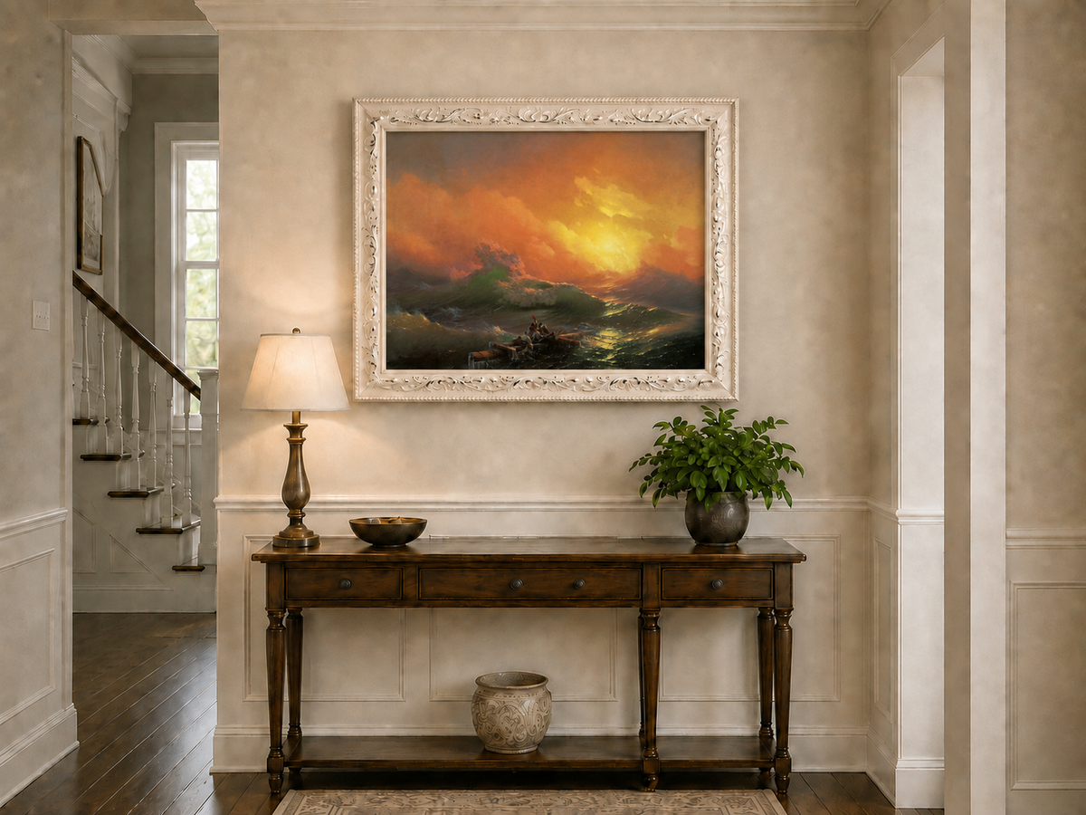 Hand-painted stormy sea with raft at sunset landscape oil painting displayed above a console table in a hallway interior.