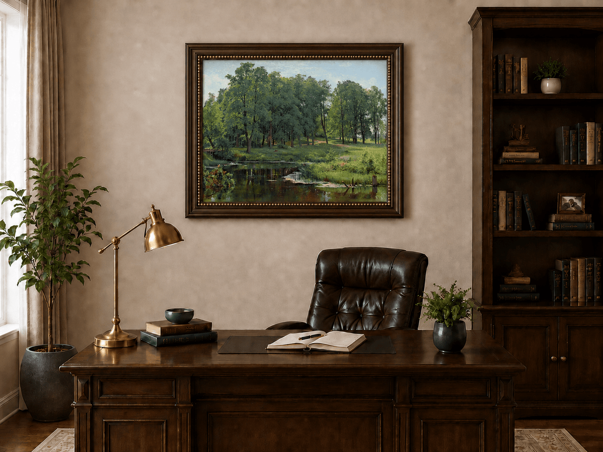 Framed hand-painted summer forest oil painting with a river, path and lush green trees displayed above a traditional home office desk.