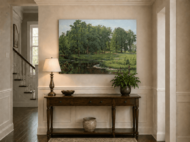 Unframed hand-painted summer forest oil painting with a river, path and lush green trees displayed above an entryway console table.