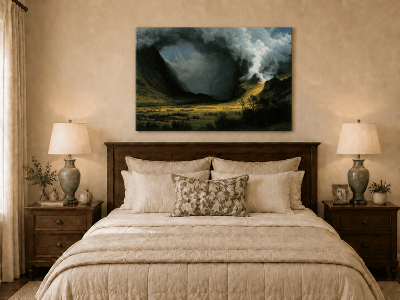 Unframed hand-painted landscape oil painting with sunlight beneath dramatic storm clouds displayed above a wooden bed in a neutral bedroom.
