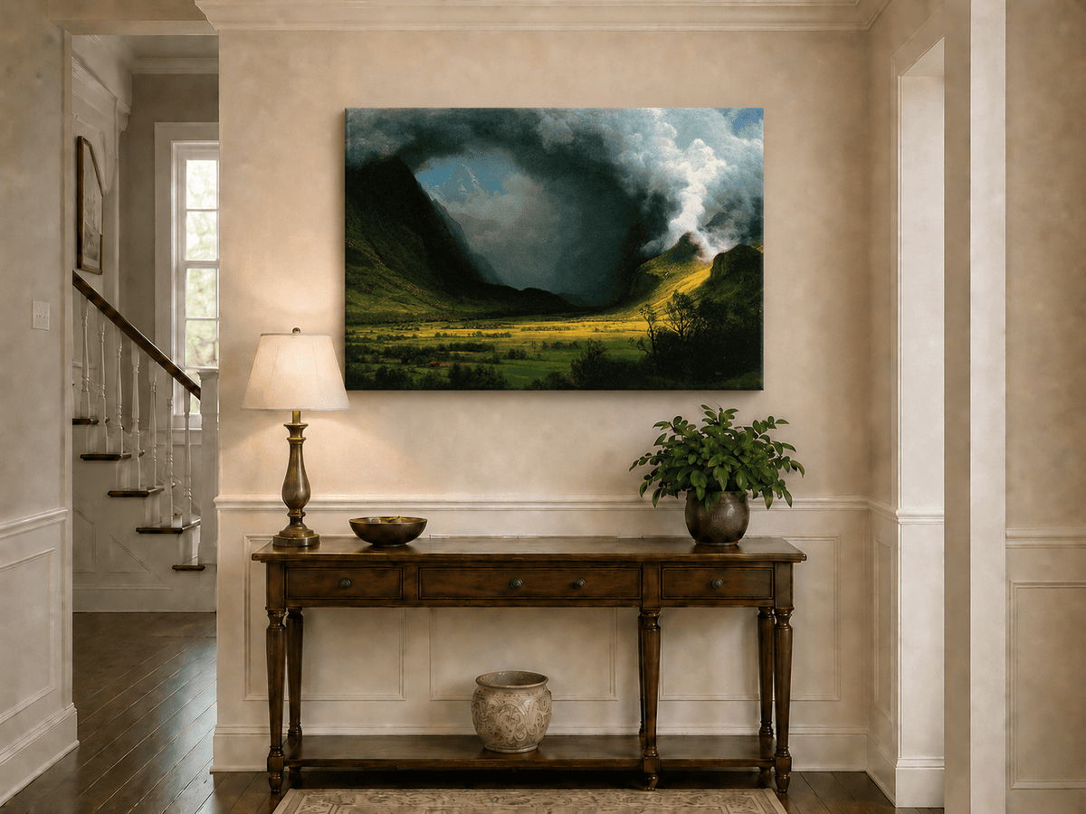 Unframed hand-painted landscape oil painting with sunlight beneath dramatic storm clouds displayed above an entryway console table.
