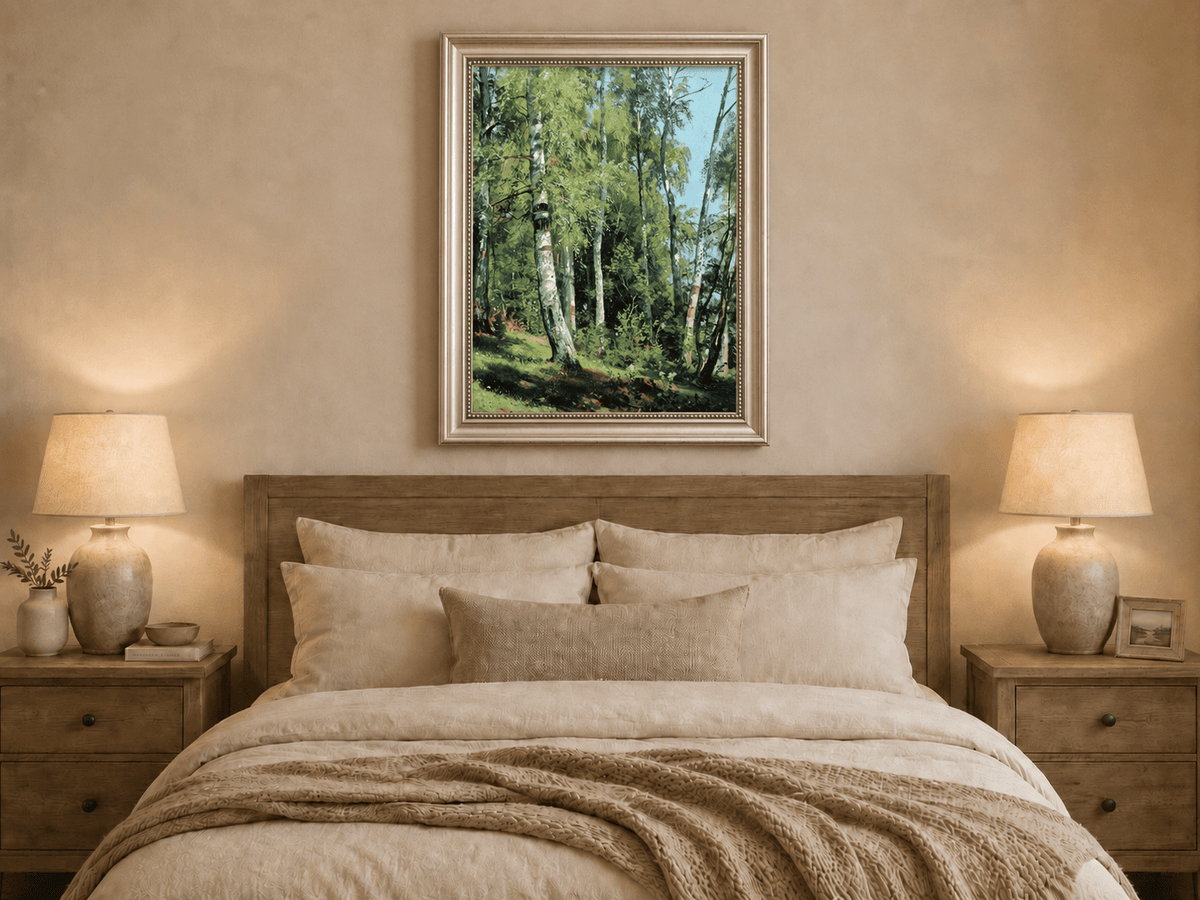 Framed hand-painted sunlit birch forest oil painting with a bright woodland clearing displayed above a wooden bed in a neutral bedroom.