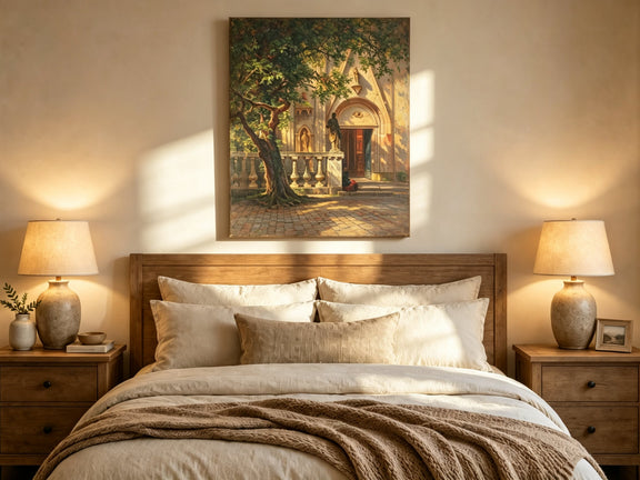Unframed hand-painted church courtyard oil painting with an old tree in warm sunlight displayed above a wooden bed in a neutral bedroom.