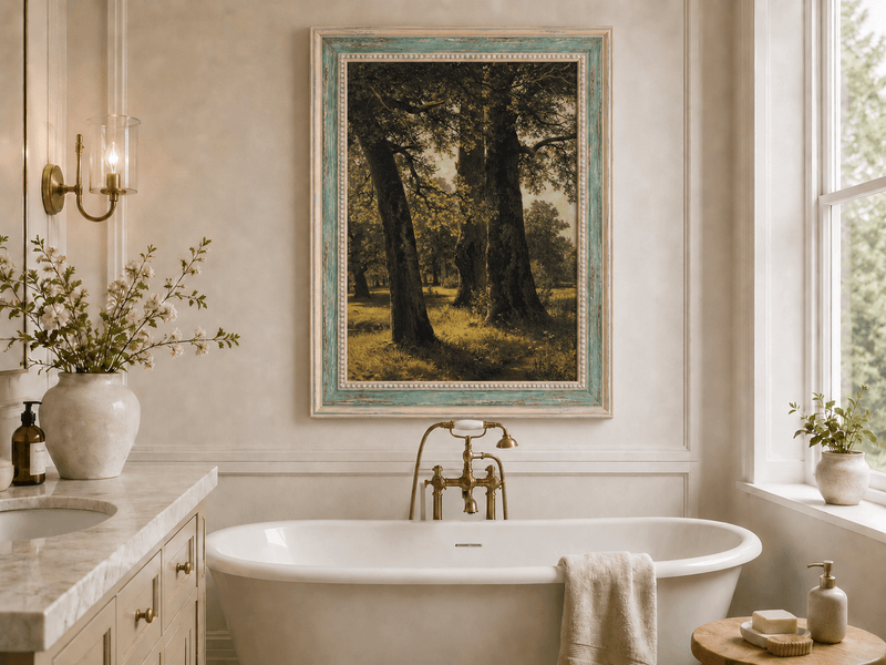Framed hand-painted sunlit forest oil painting with massive ancient trees and golden ground displayed above a freestanding bathtub.