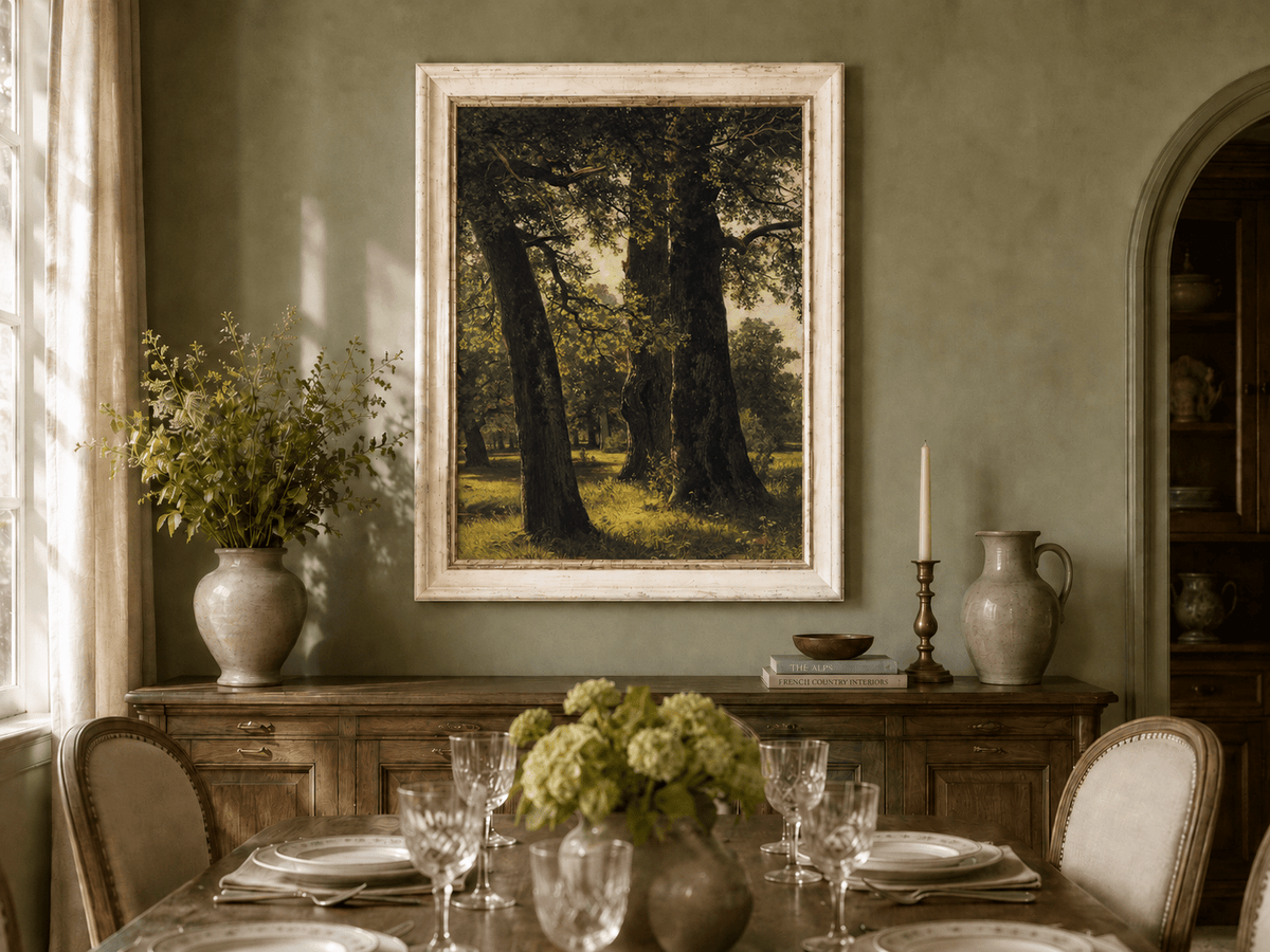Framed hand-painted sunlit forest oil painting with massive ancient trees and golden ground displayed above a formal dining table.