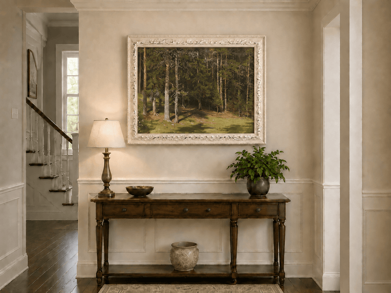 Framed hand-painted sunlit forest glade oil painting with a peaceful woodland clearing displayed above an entryway console table.