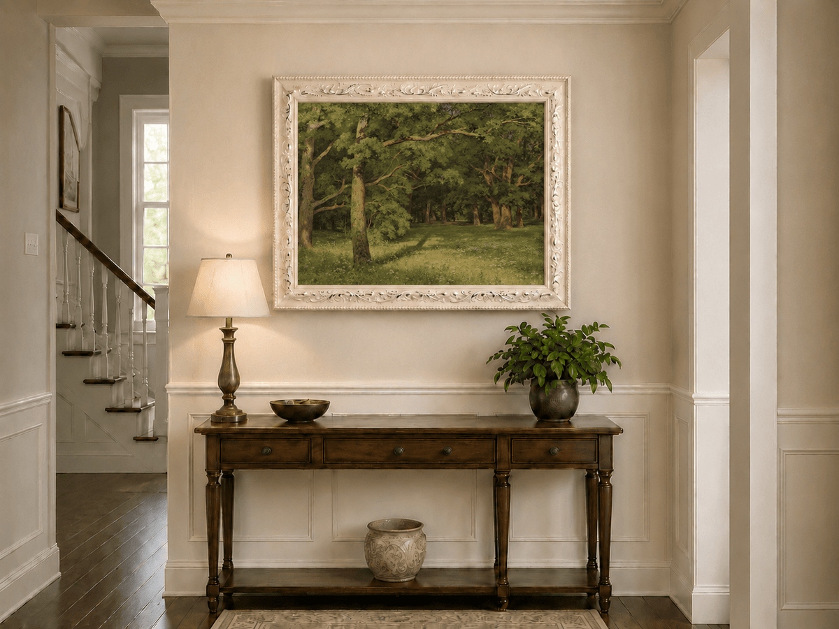 Framed hand-painted sunlit forest glade oil painting with colorful wildflowers displayed above an entryway console table.