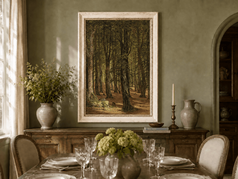 Framed hand-painted sunlit forest interior oil painting with a warm path beneath tall trees displayed above a formal dining table.