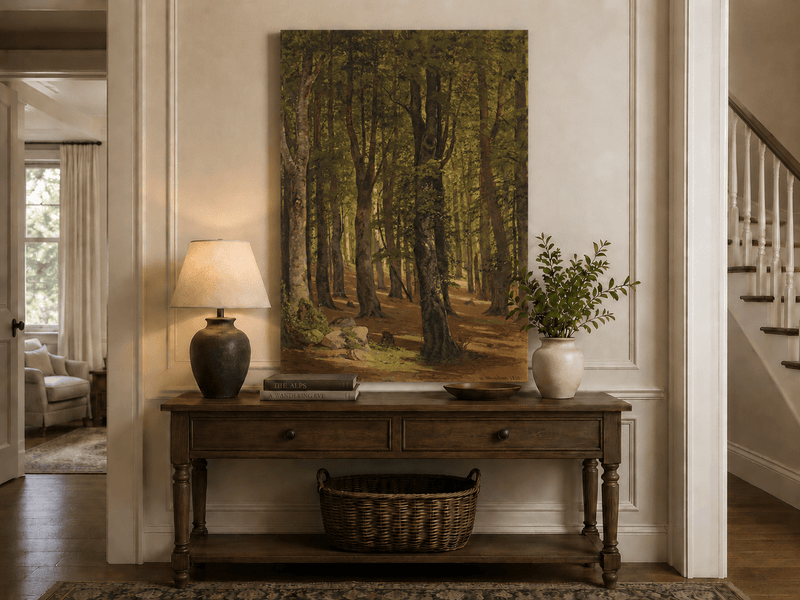 Unframed hand-painted sunlit forest interior oil painting with a warm path beneath tall trees displayed above an entryway console table.