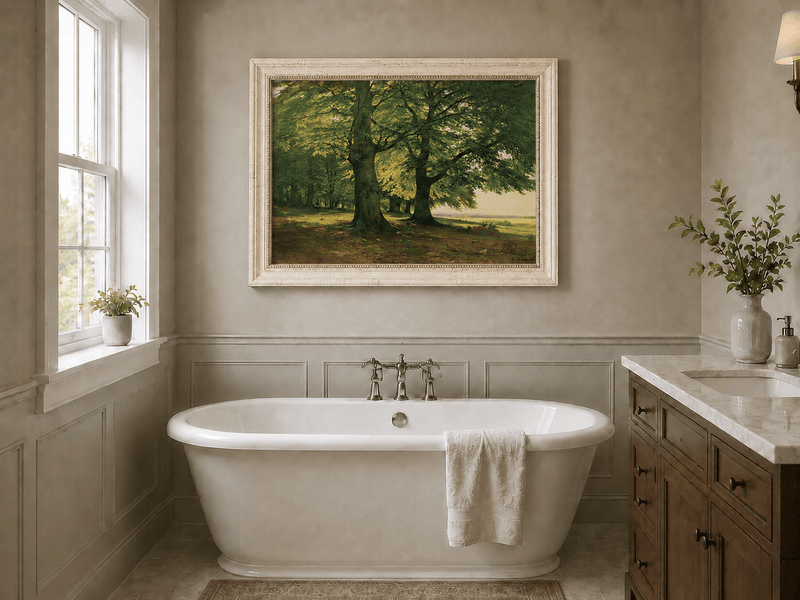 Framed hand-painted sunlit forest oil painting with two large spreading trees displayed above a freestanding bathtub.