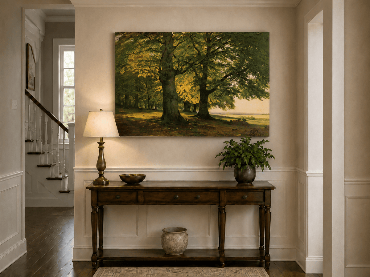 Unframed hand-painted sunlit forest oil painting with two large spreading trees displayed above an entryway console table.