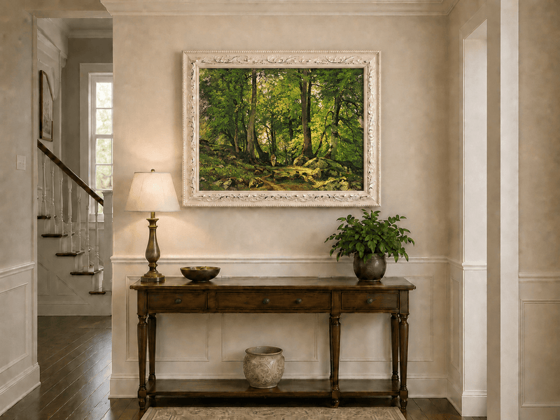 Framed hand-painted sunlit forest path oil painting with a solitary figure among green trees displayed above an entryway console table.