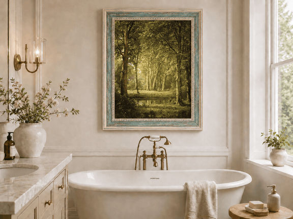 Framed hand-painted sunlit forest pond oil painting with tall trees and golden reflections displayed above a freestanding bathtub.