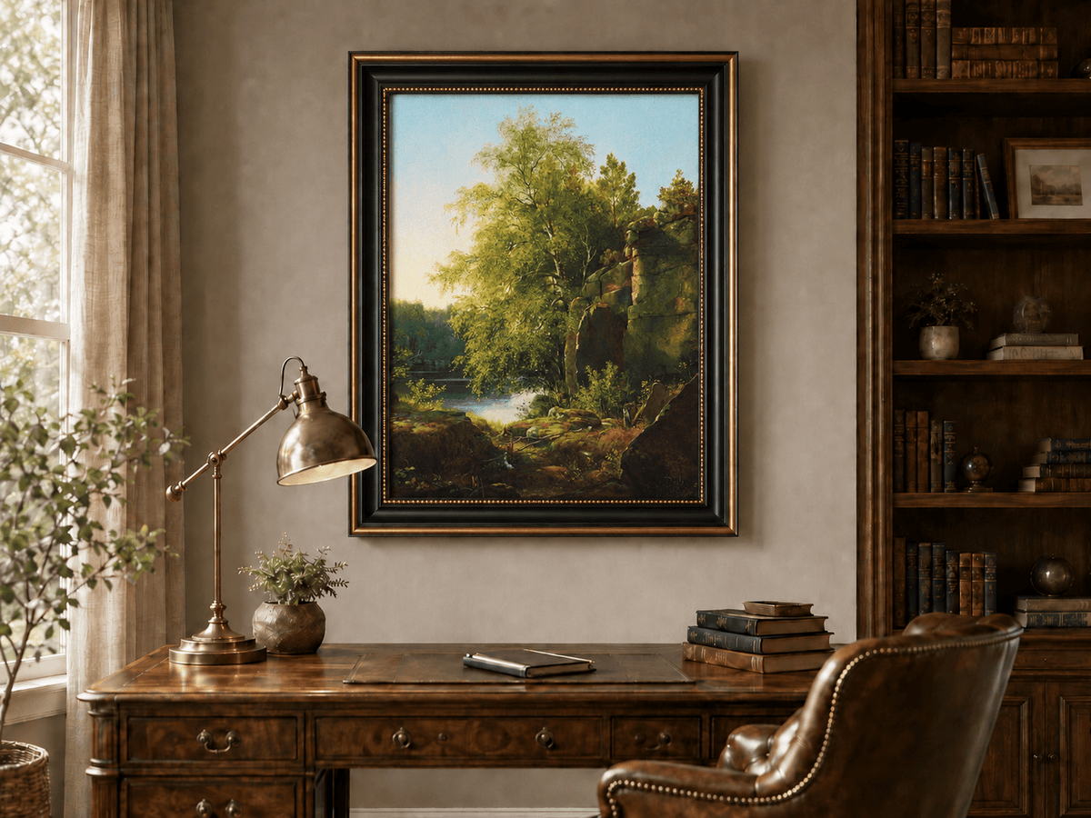 Framed hand-painted sunlit lakeside oil painting with rocks and leafy birch trees displayed above a traditional home office desk.