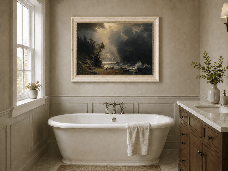 Framed hand-painted sunlit mountain valley oil painting beneath dramatic storm clouds displayed above a freestanding bathtub.