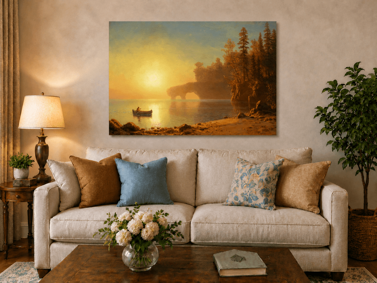 Unframed hand-painted sunset lake oil painting with a canoe on glowing water displayed above a neutral living room sofa.