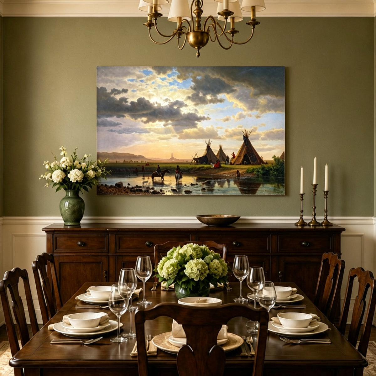 Unframed hand-painted sunset river camp oil painting with tipis and riders crossing the water displayed above a formal dining table.