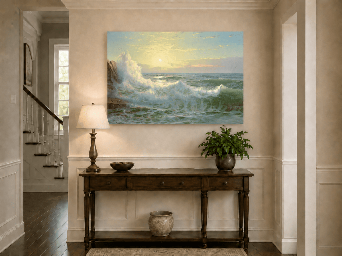Unframed hand-painted sunset seascape oil painting with luminous crashing waves displayed above an entryway console table.