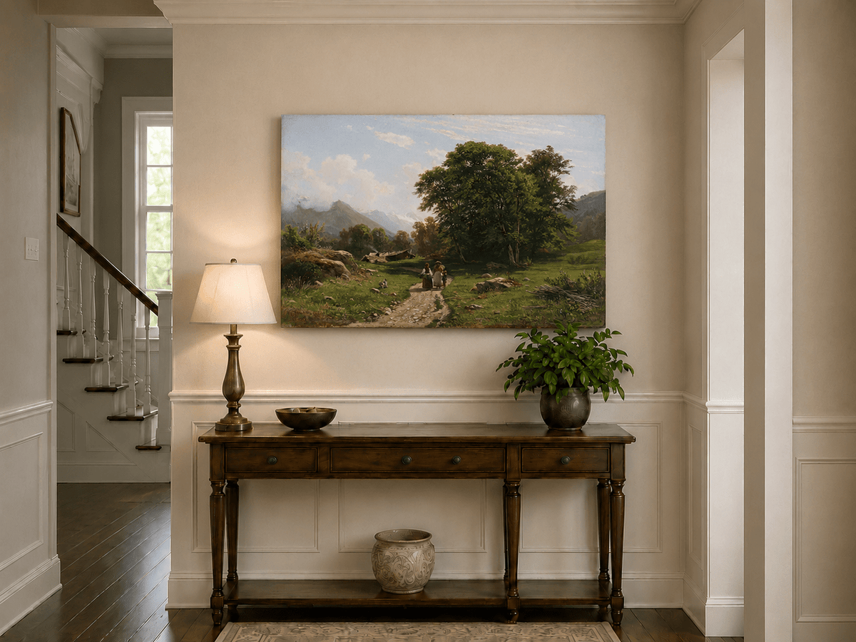 Unframed hand-painted Swiss landscape oil painting with a country path, trees and distant peaks displayed above an entryway console table.