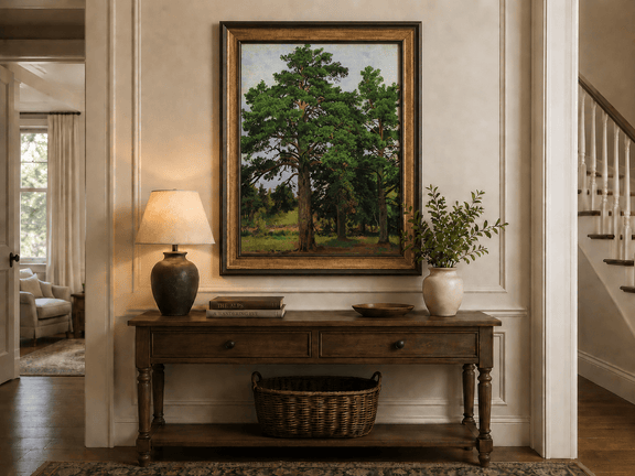 Framed hand-painted woodland meadow oil painting with a grove of tall pine trees displayed above an entryway console table.