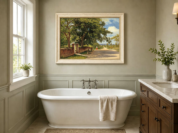 Framed hand-painted country road oil painting with figures beneath broad leafy trees displayed above a freestanding bathtub.
