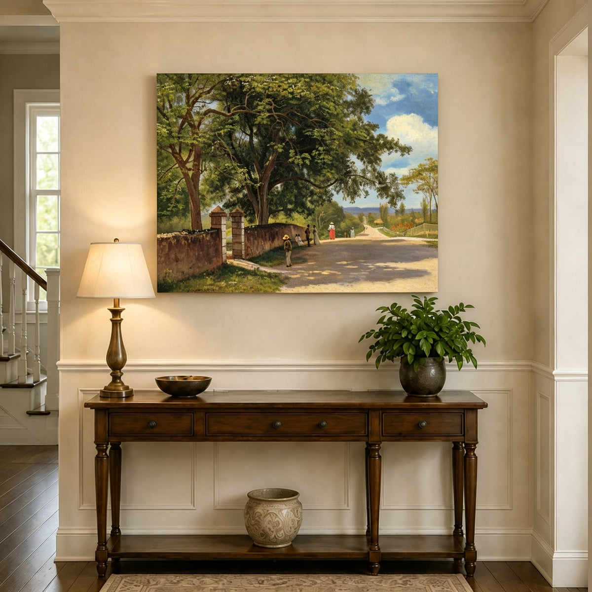 Unframed hand-painted country road oil painting with figures beneath broad leafy trees displayed above an entryway console table.