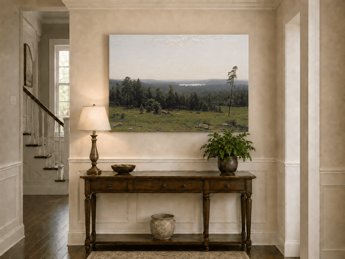 Unframed hand-painted panoramic oil painting with a vast forest, meadow and distant lake displayed above an entryway console table.