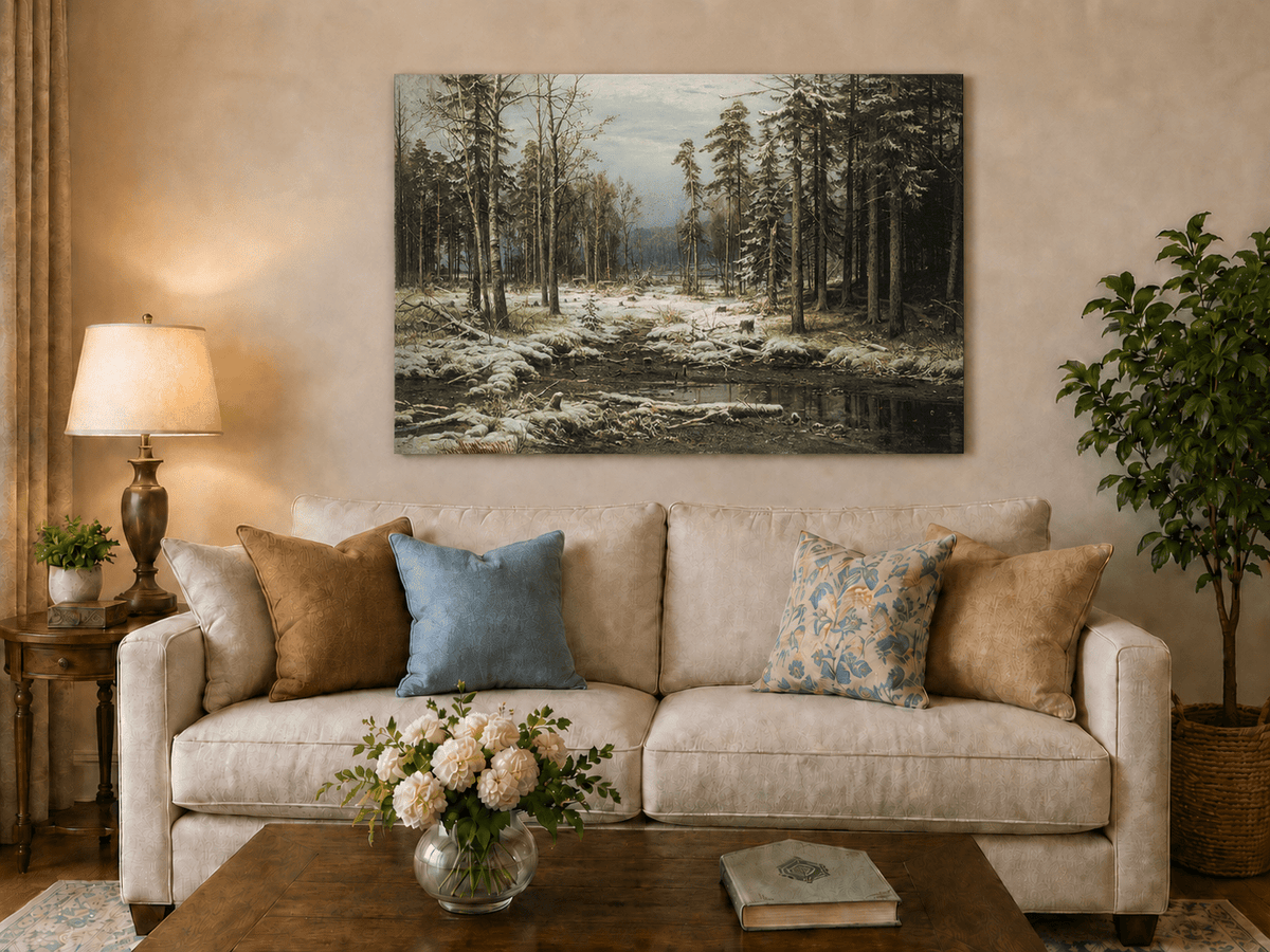 Unframed hand-painted winter forest oil painting with a flowing stream through snowy woods displayed above a neutral living room sofa.