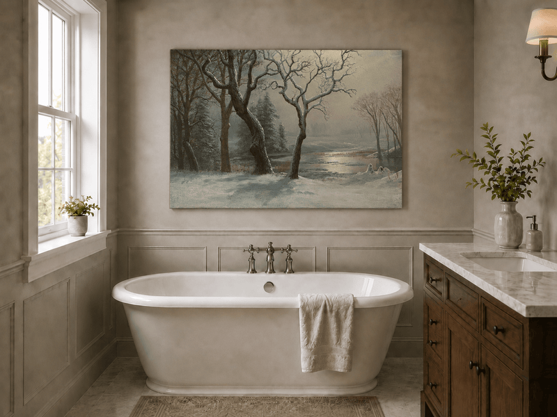 Unframed hand-painted winter river oil painting with bare trees in a snowy forest displayed above a freestanding bathtub.
