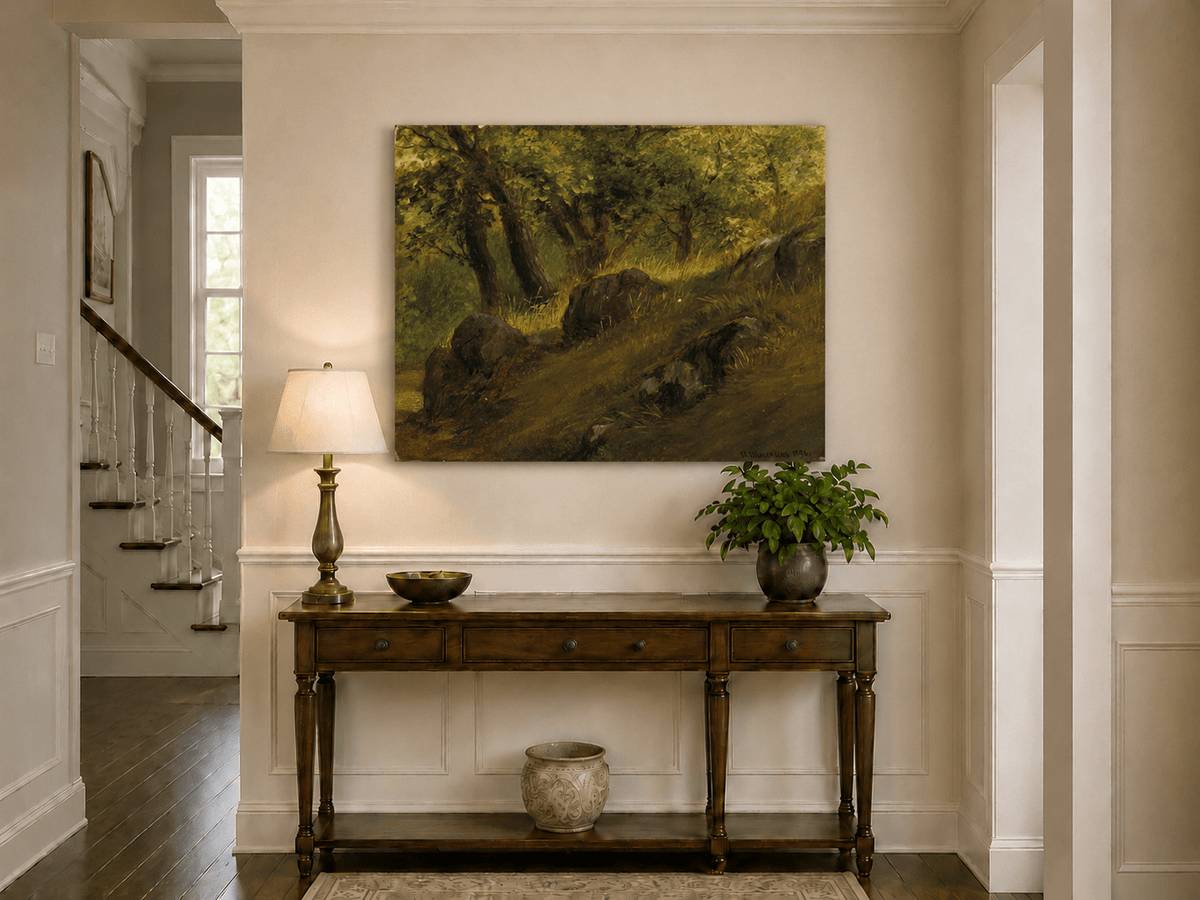 Unframed hand-painted wooded hillside oil painting with mossy rocks and sunlit trees displayed above an entryway console table.