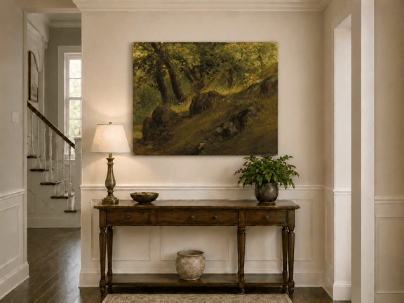 Unframed hand-painted wooded hillside oil painting with mossy rocks and sunlit trees displayed above an entryway console table.