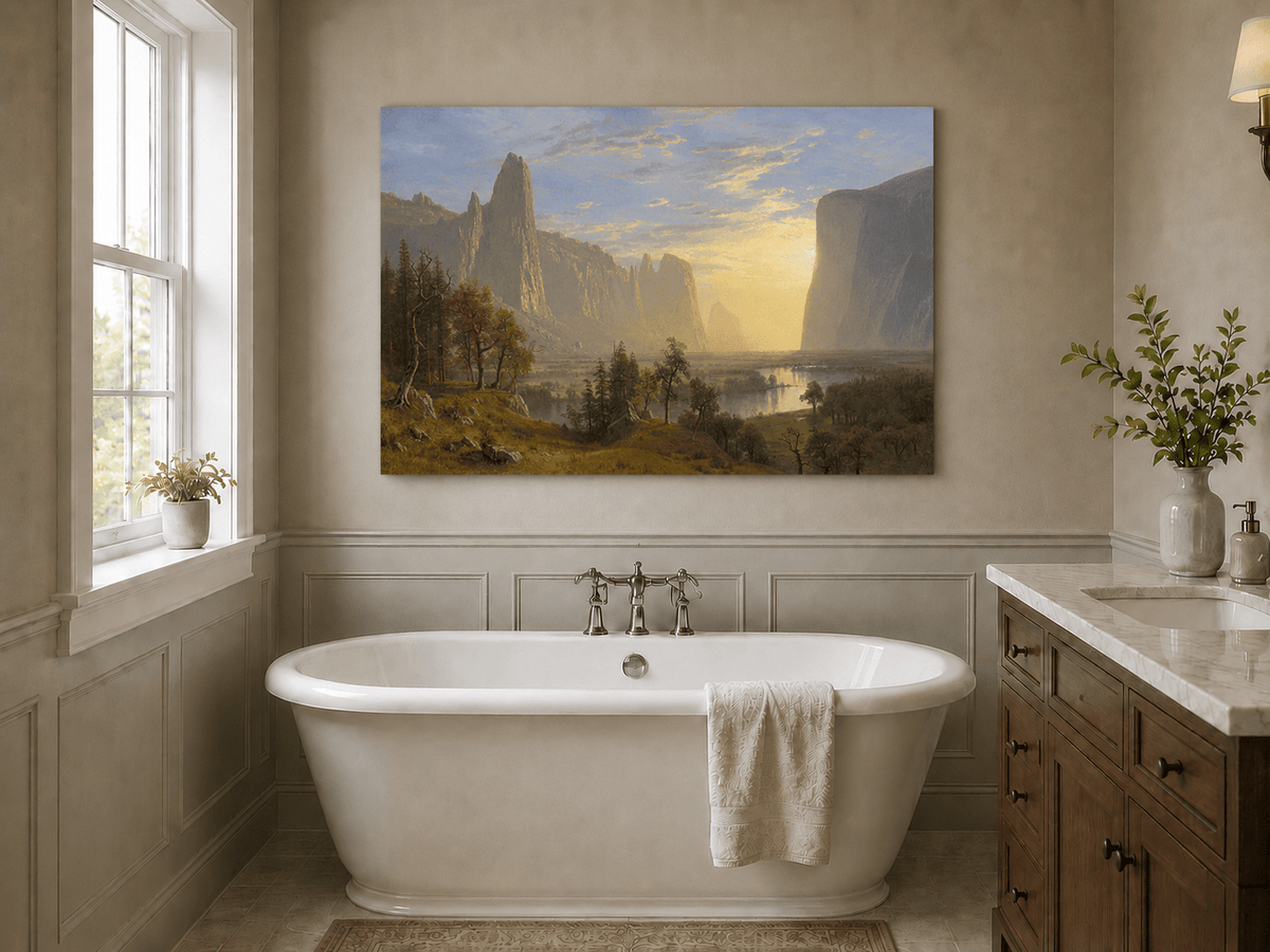Unframed hand-painted Yosemite Valley oil painting with towering cliffs in golden light displayed above a freestanding bathtub.