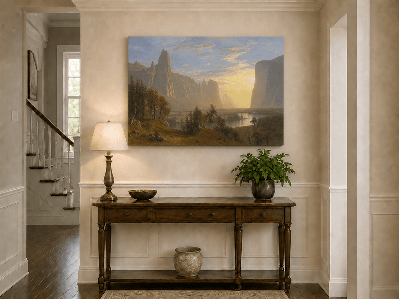 Unframed hand-painted Yosemite Valley oil painting with towering cliffs in golden light displayed above an entryway console table.